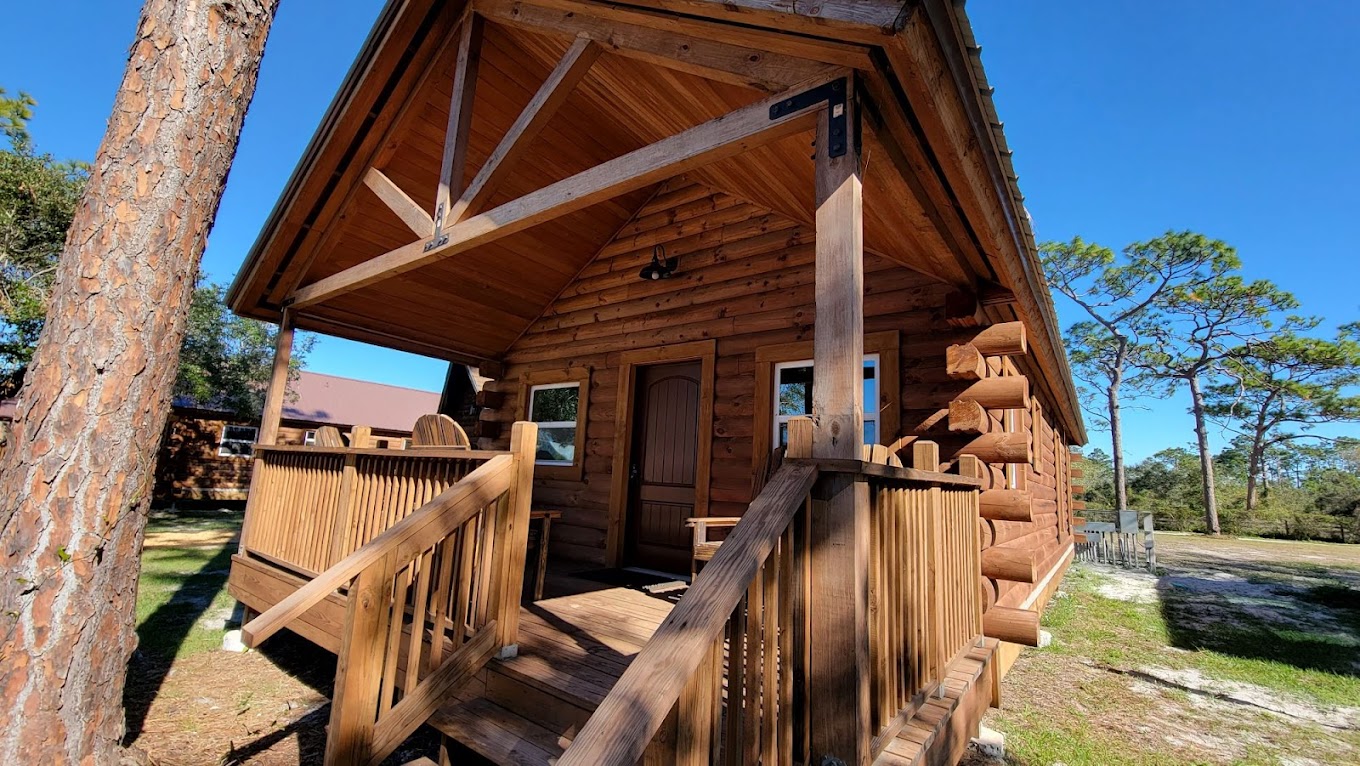 Log cabin exterior at Camp Impact